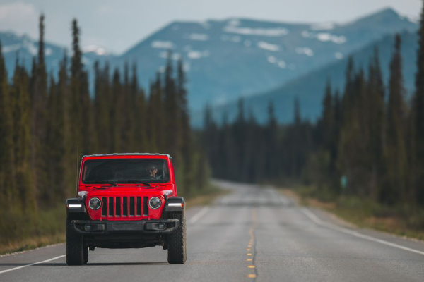 An Iconic Offroad Jeep Wrangler On An Empty Road In A Beautiful Location In Italy.